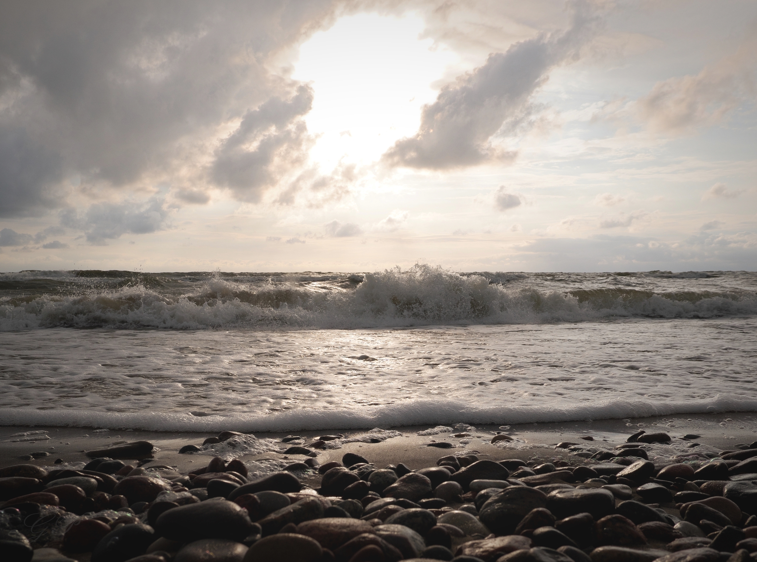 Sea Waves Play with Stones